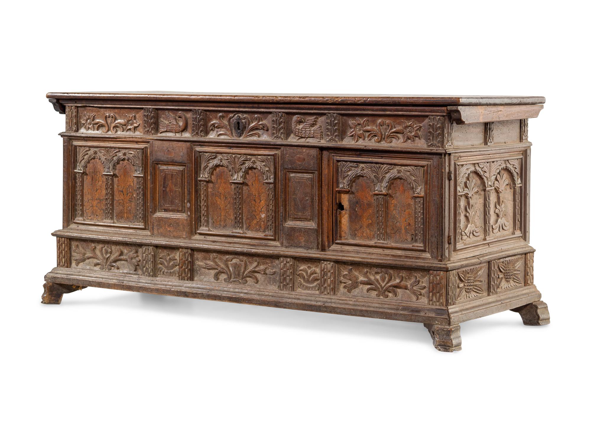 A Continental Carved and Inlaid Walnut Coffer
