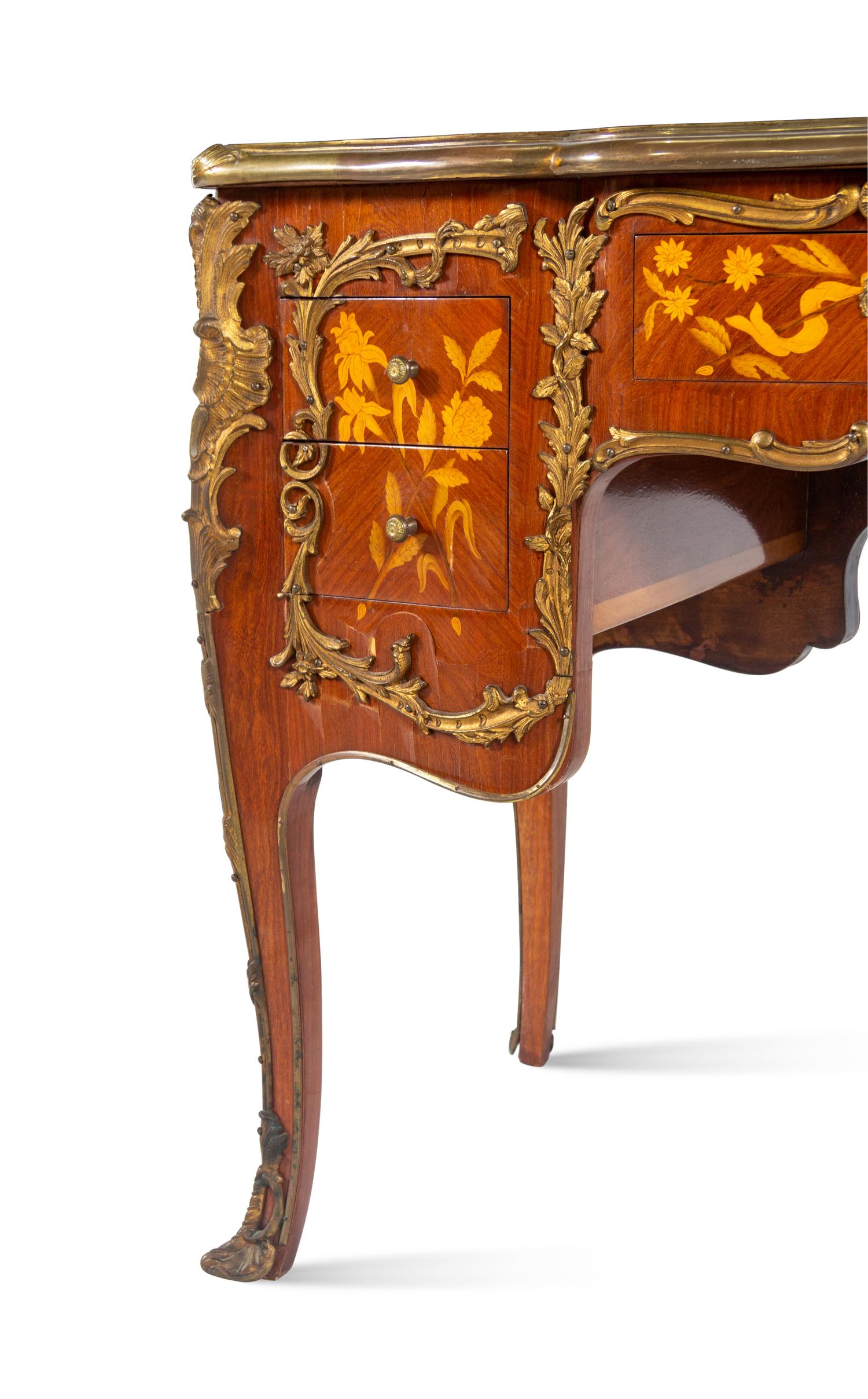 A Louis XV Style Gilt Bronze Mounted Marquetry Desk