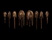A Bamana Wood Marionette Figure with Eight Wood Puppet Heads