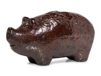 An Ohio Brown-Glazed Sewer Tile Pig