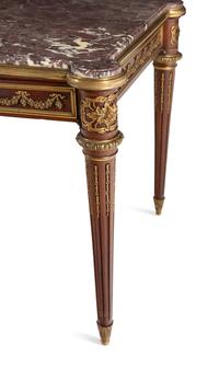 A Louis XVI Style Gilt Bronze Mounted Mahogany Marble-Top Center Table