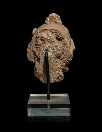 A Small Gandharan Polychromed Stucco Head of a Bodhisattva