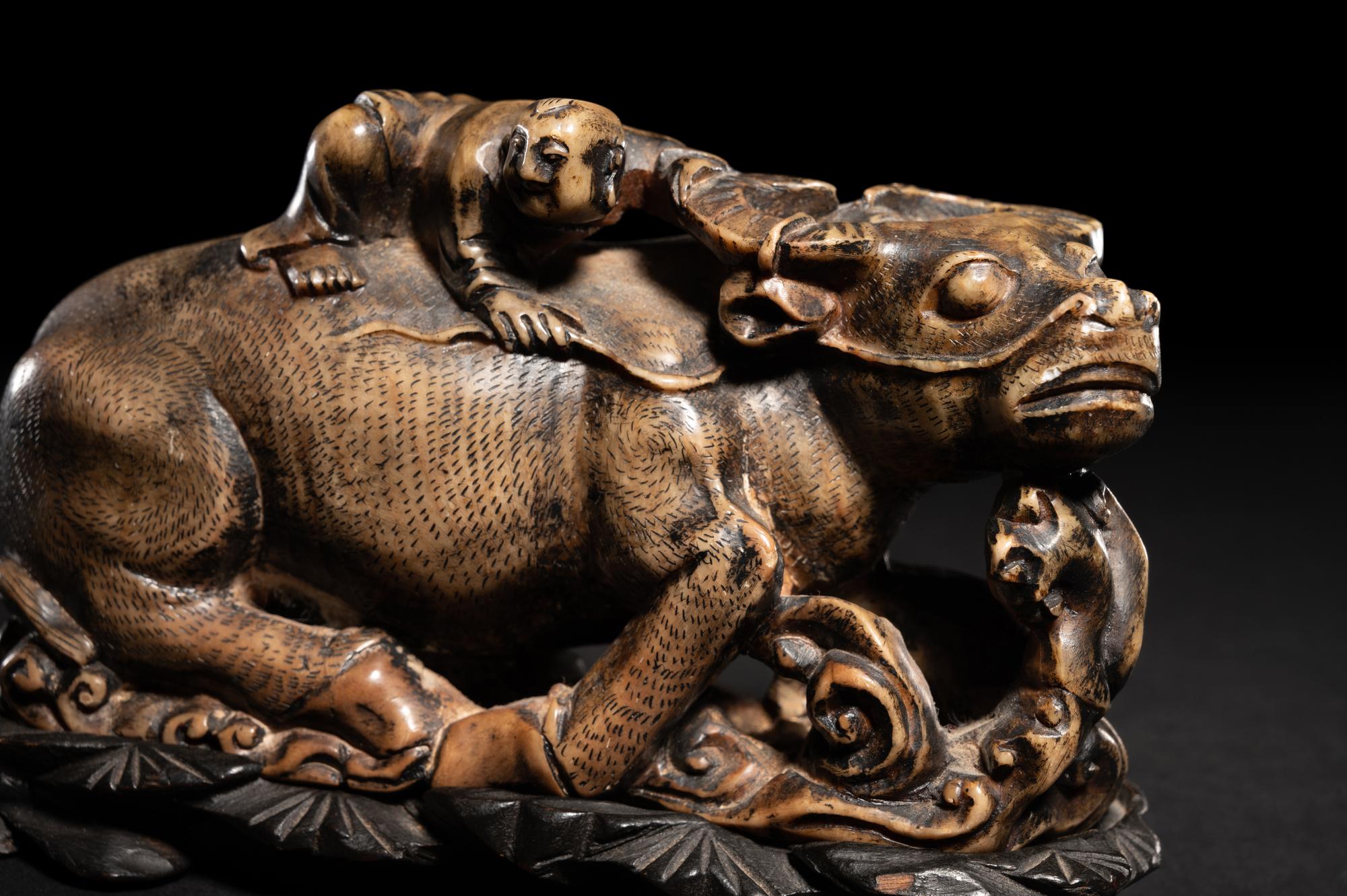 A Pair of Chinese Brown Hardstone 'Ox and Herd' Figural Groups