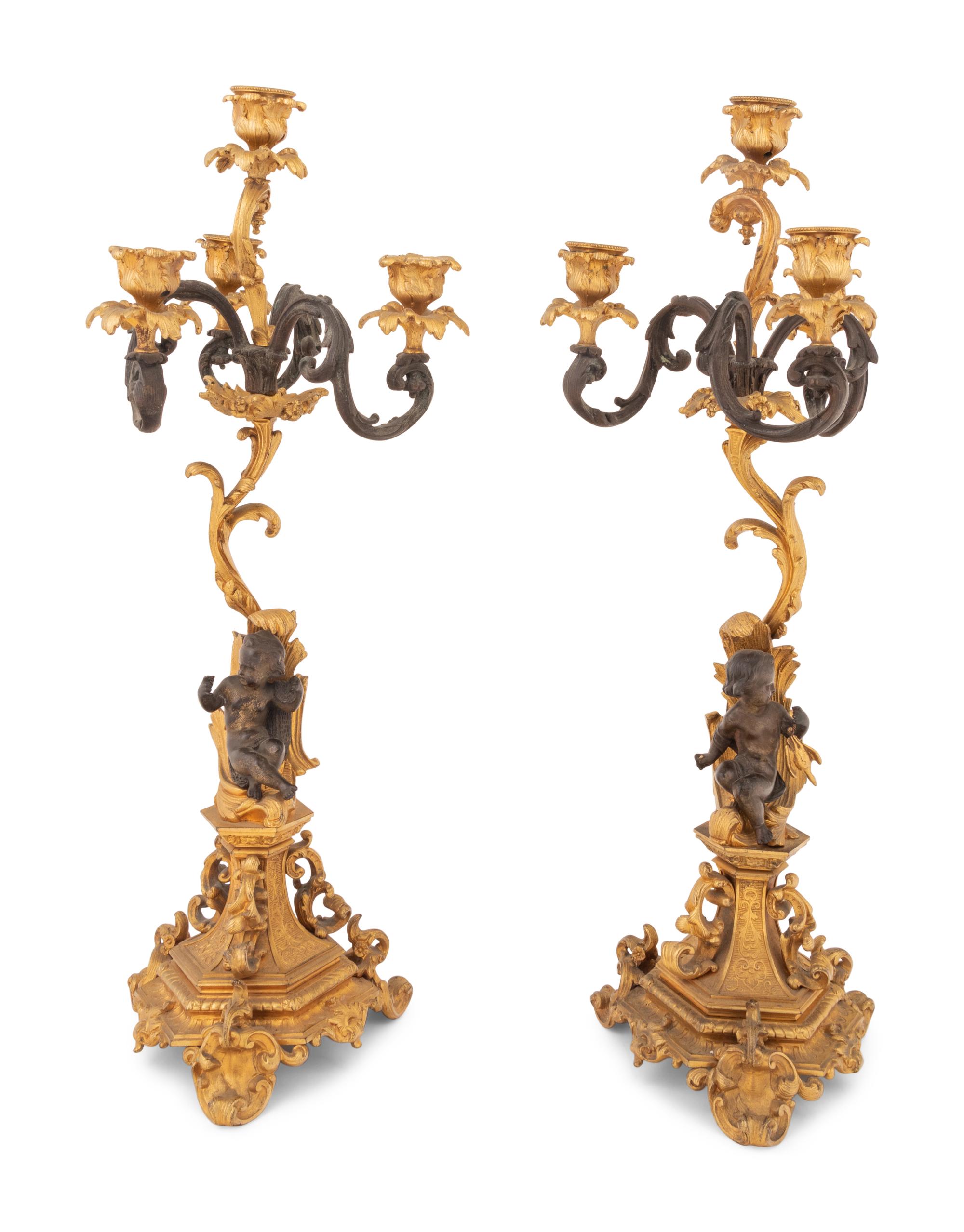 A Pair of Continental Gilt and Patinated Bronze Four-Light Candelabra