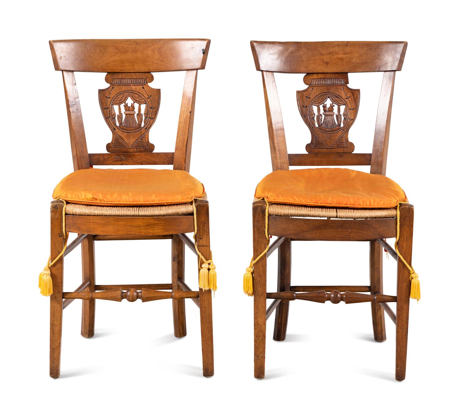 A Pair of Directoire Carved Walnut Rush-Seat Side Chairs