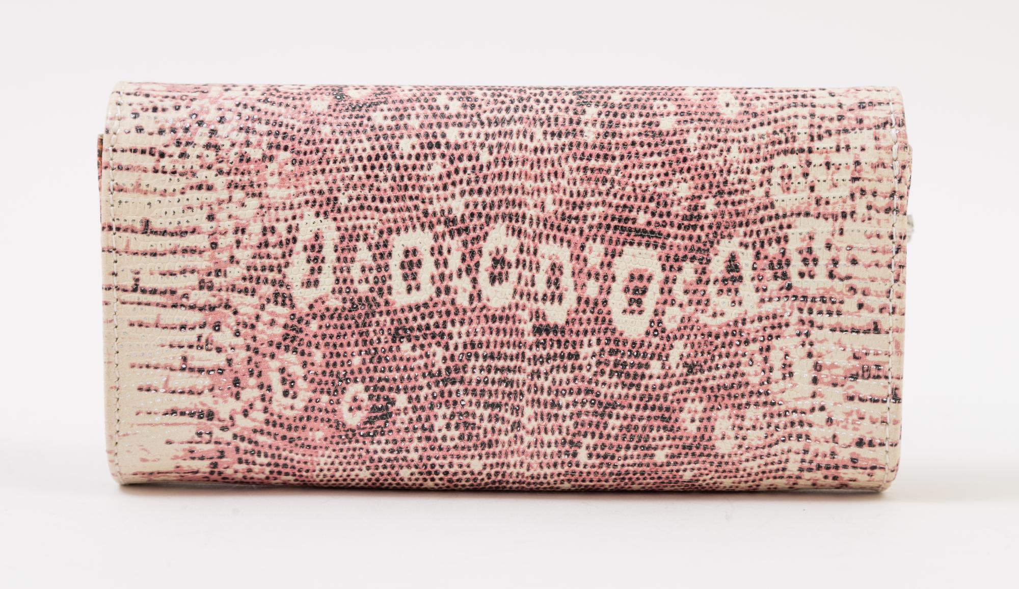 A Carlos Falchi Pink and Cream Snakeskin Clutch, 6.5" x 4" x 1.5".