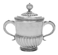 A William III Silver Two-Handled Cup and Cover, John Smith, London, 1699, of spiral fluted cylindrical form, engraved with stylized fol