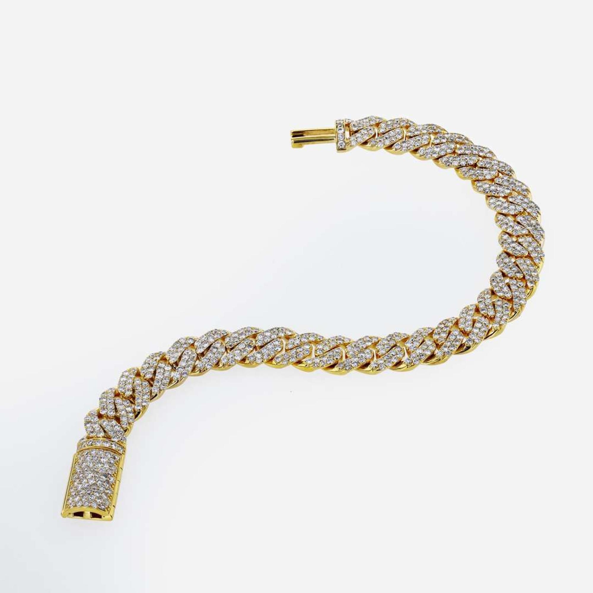 A Diamond and 14K Yellow Gold Cuban Link Bracelet