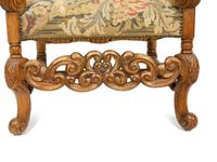 A Regence Style Carved Oak High Back Armchair with Needlework Upholstered Back and Seat — 19TH CENTURY