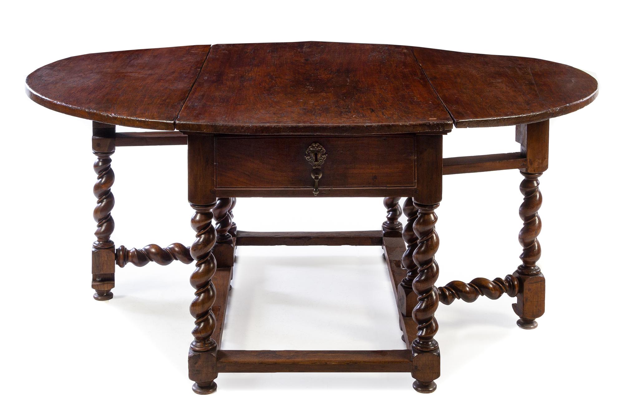A French Walnut Gate-Leg Table Height 30 1/2 x width 52 1/4 x depth 30 1/4 inches (closed). — 18TH/19TH CENTURY
