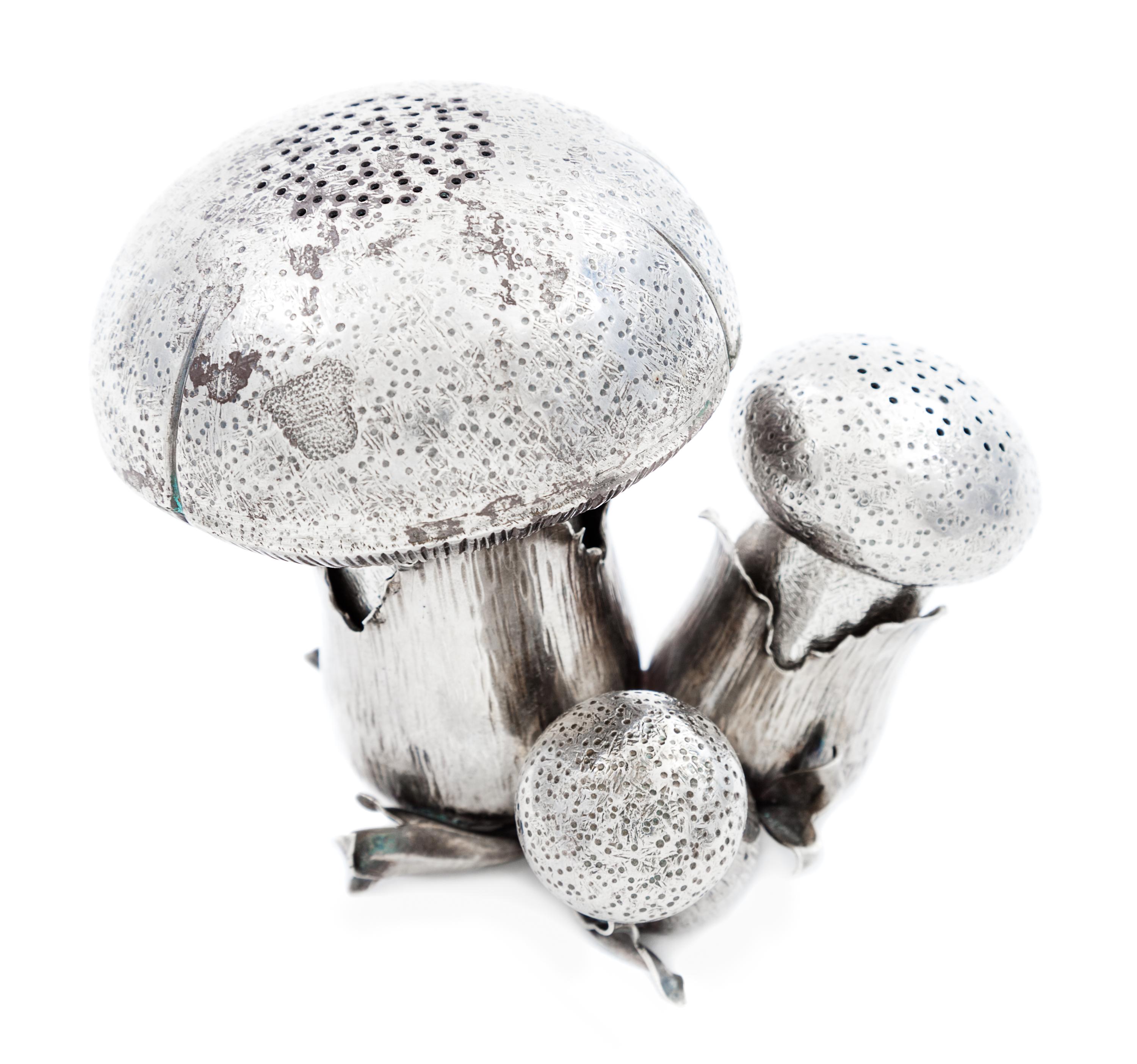An Italian Silver Salt and Pepper Set, Buccellati, in the form of three mushrooms.