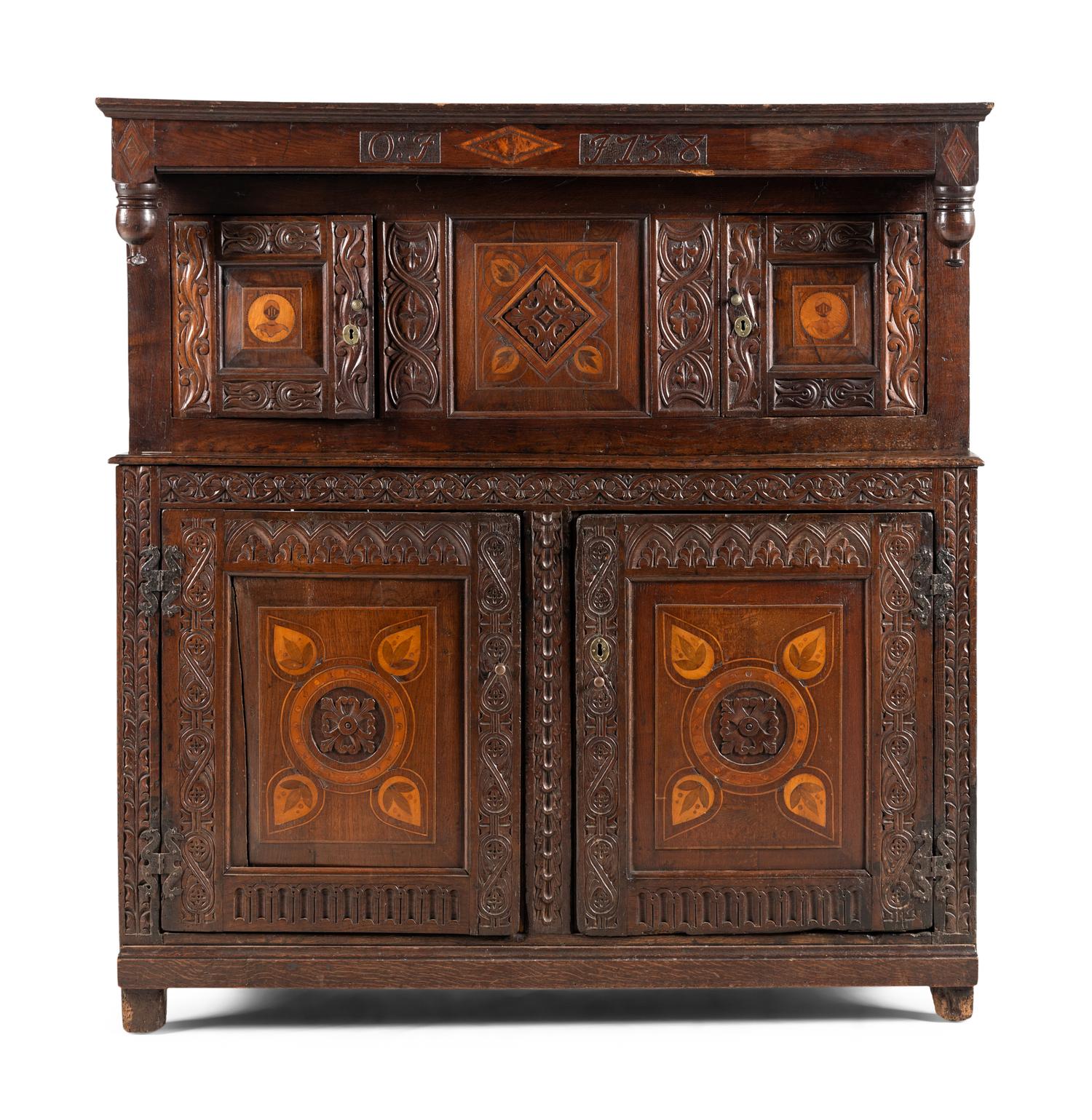 A Jacobean Carved Oak and Marquetry Court Cupboard