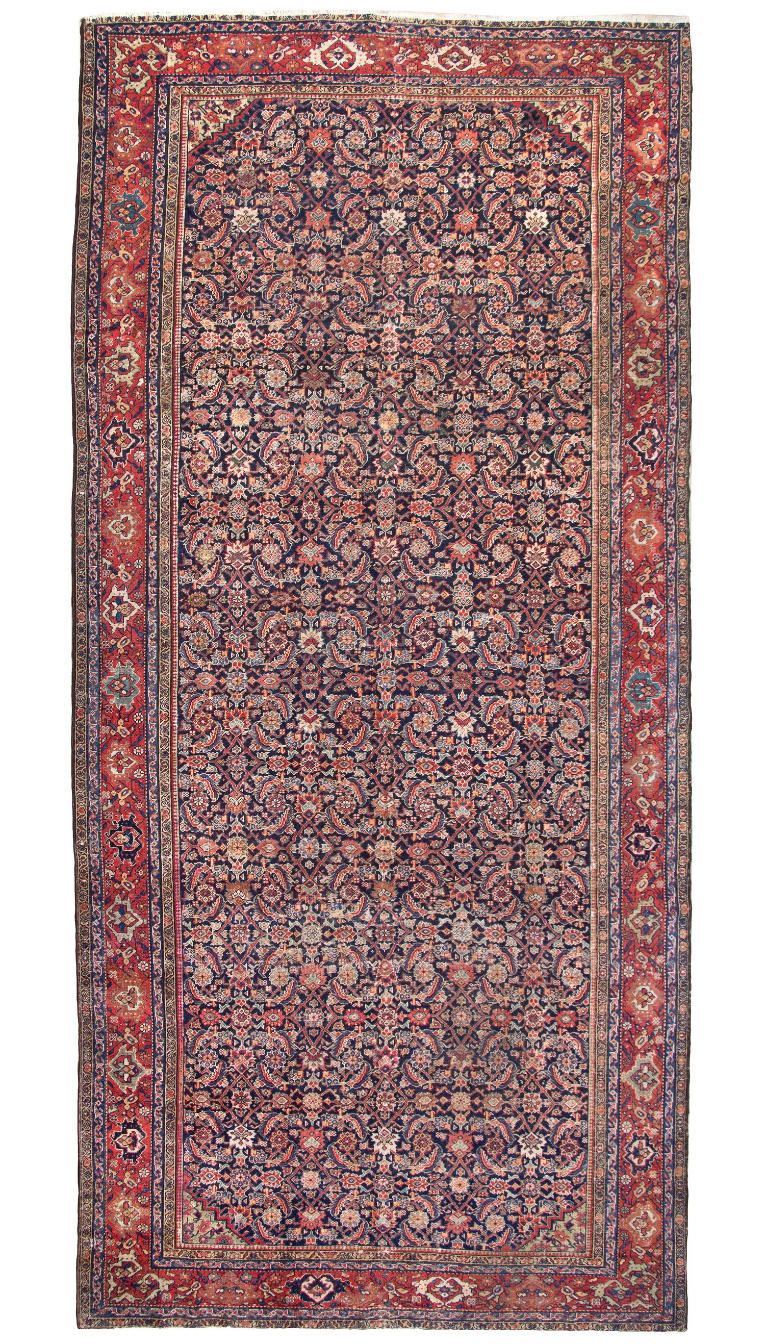 A Ferrehan Wool Rug, 12 feet 9 inches x 6 feet 1 inch.