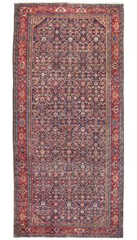 A Ferrehan Wool Rug, 12 feet 9 inches x 6 feet 1 inch.