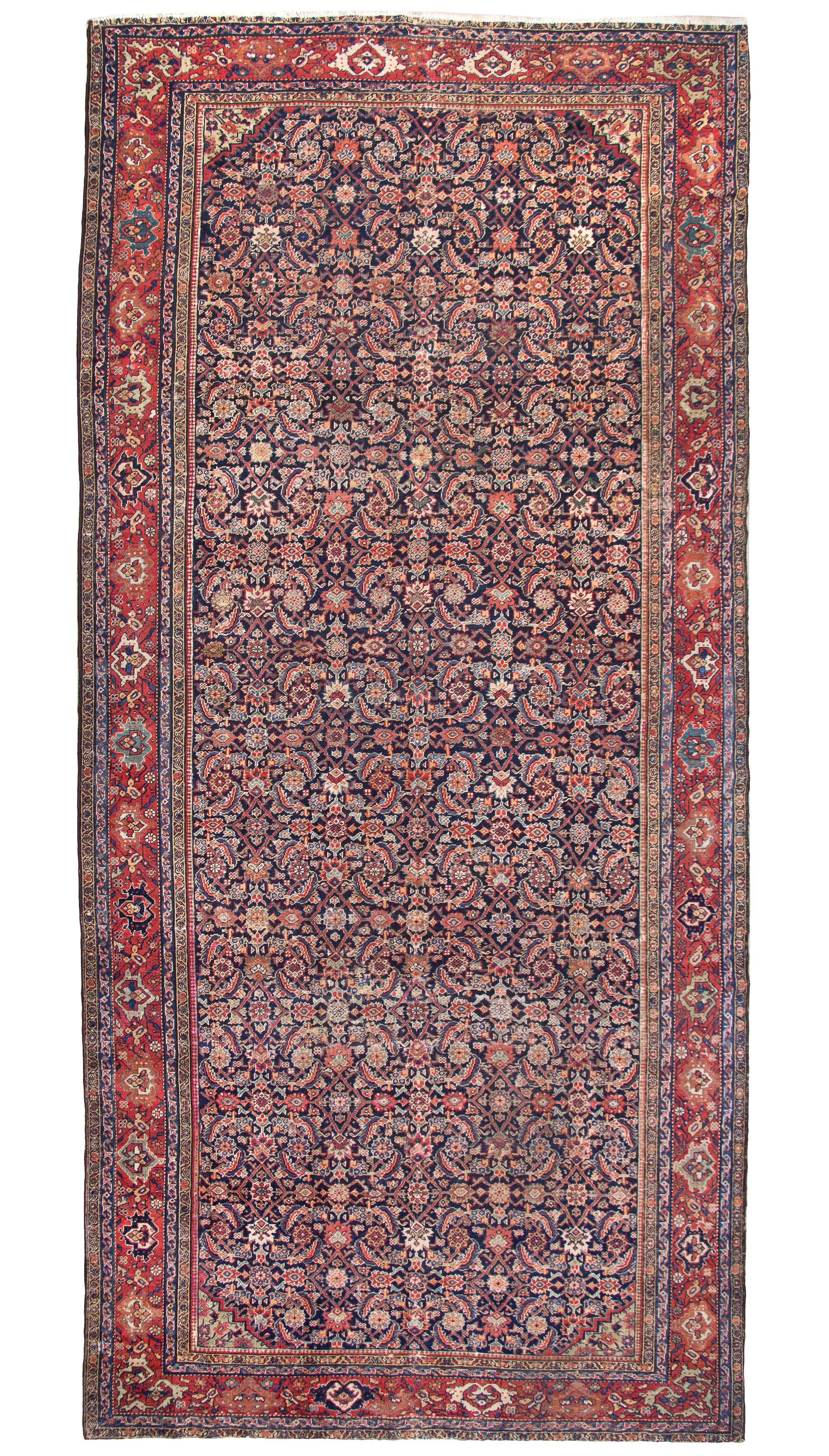 A Ferrehan Wool Rug, 12 feet 9 inches x 6 feet 1 inch.