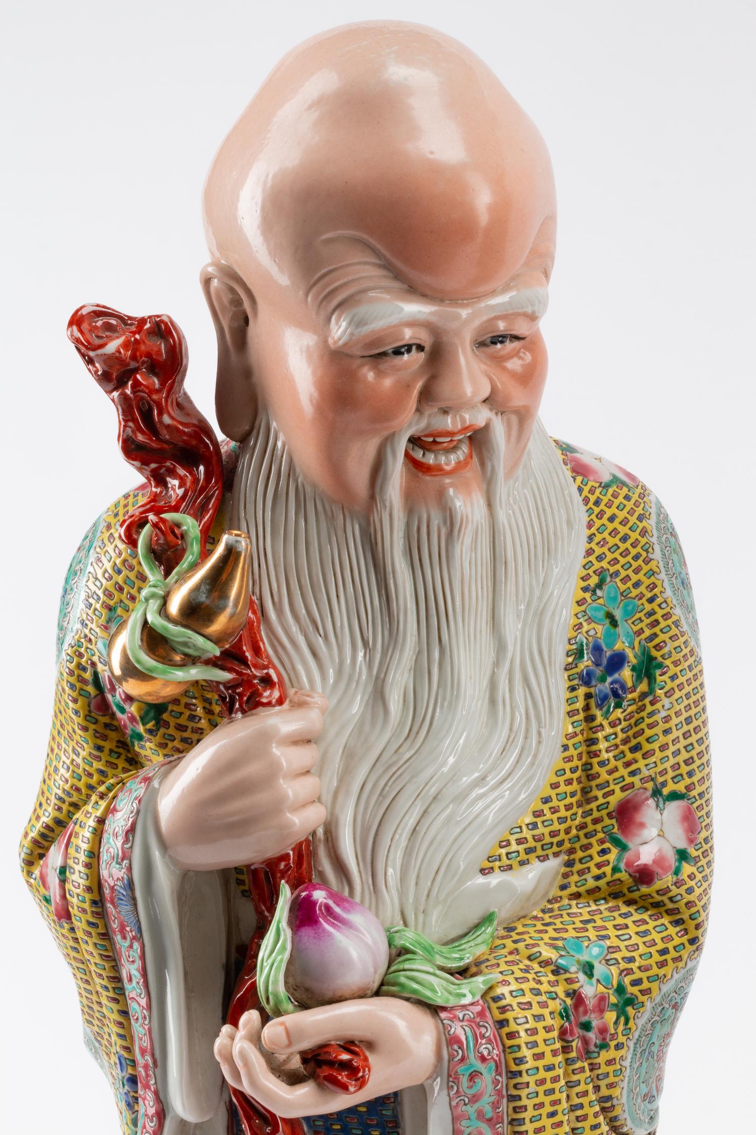 Three Chinese Export Enameled Porcelain Figures of Scholars