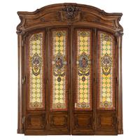 A French Carved Walnut and Leaded Glass Double-Door Portal