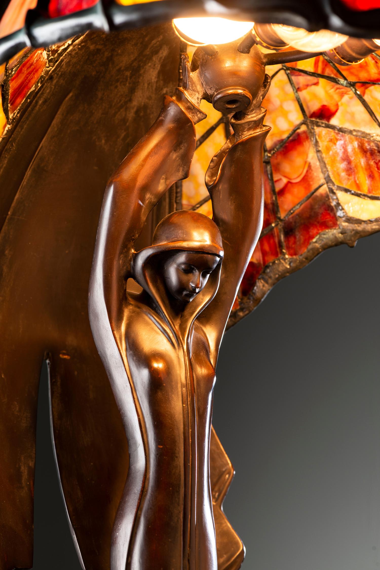 A Cast Bronze and Glass Figural Table Lamp