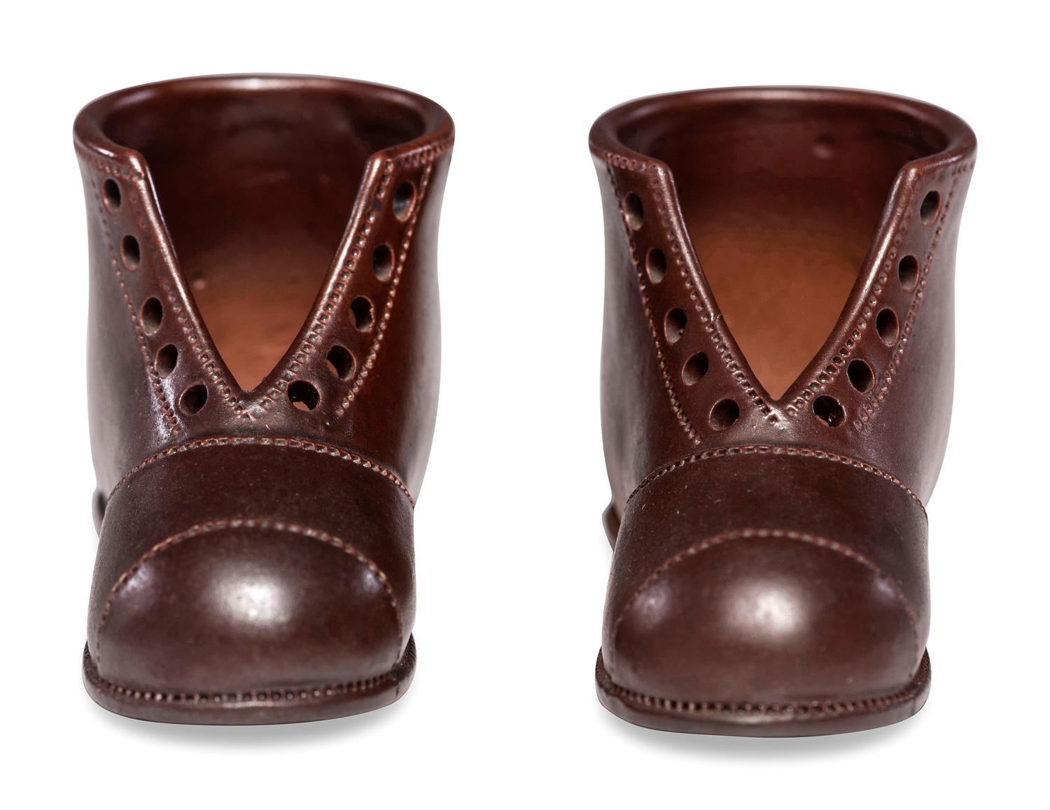 A Pair of Finely Crafted Glazed Pottery Shoes