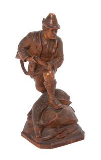 A German Wood Figure of a Hunter Height 11 3/4 inches.