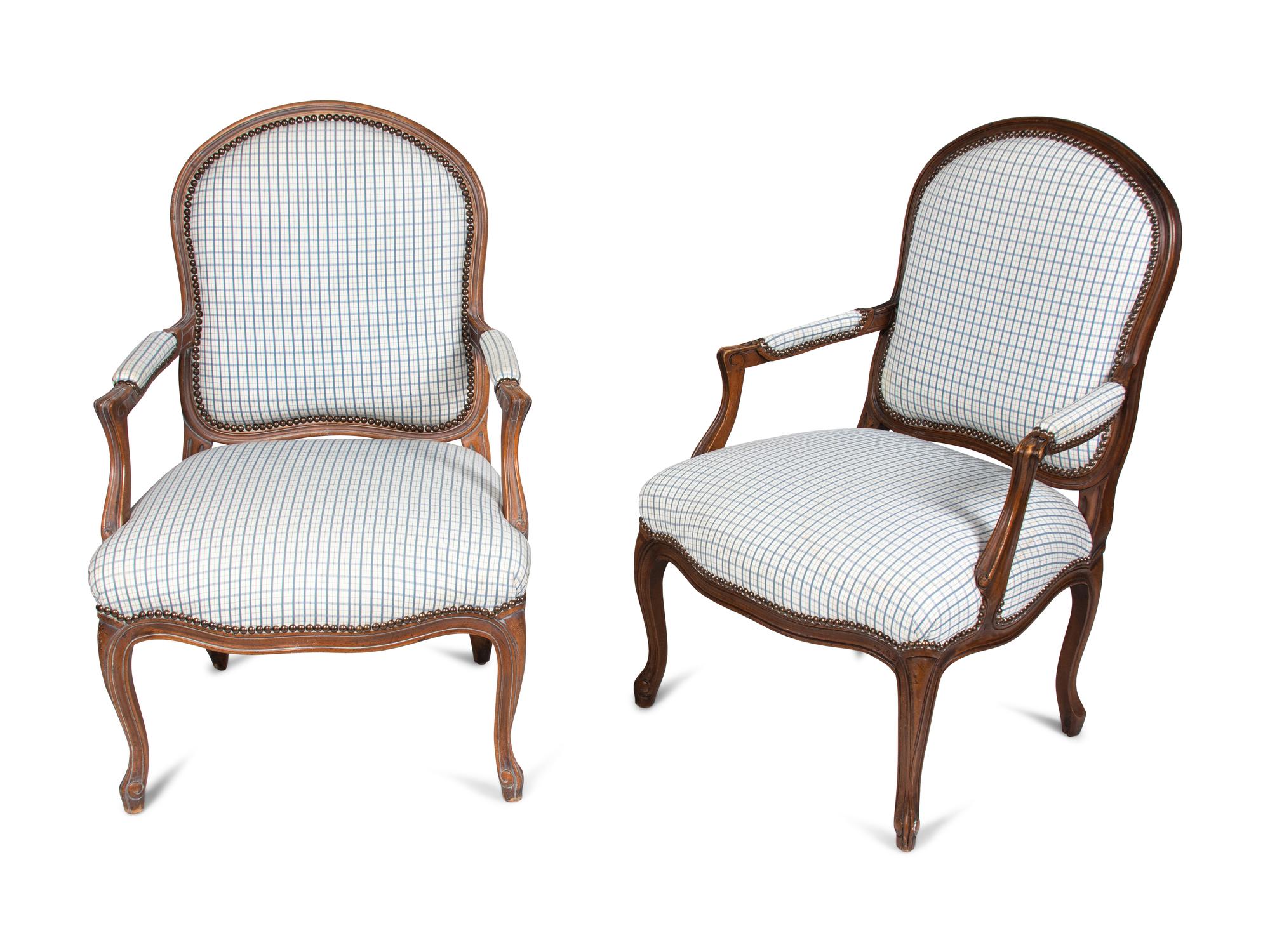 A Pair of Louis XV Style Fauteuils and an Associated Stool