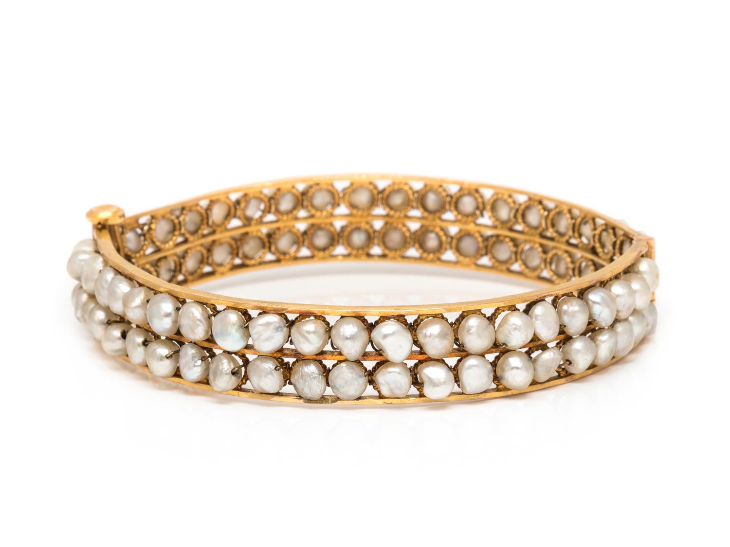 A Yellow Gold and Cultured Pearl Bangle Bracelet,