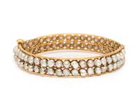 A Yellow Gold and Cultured Pearl Bangle Bracelet,