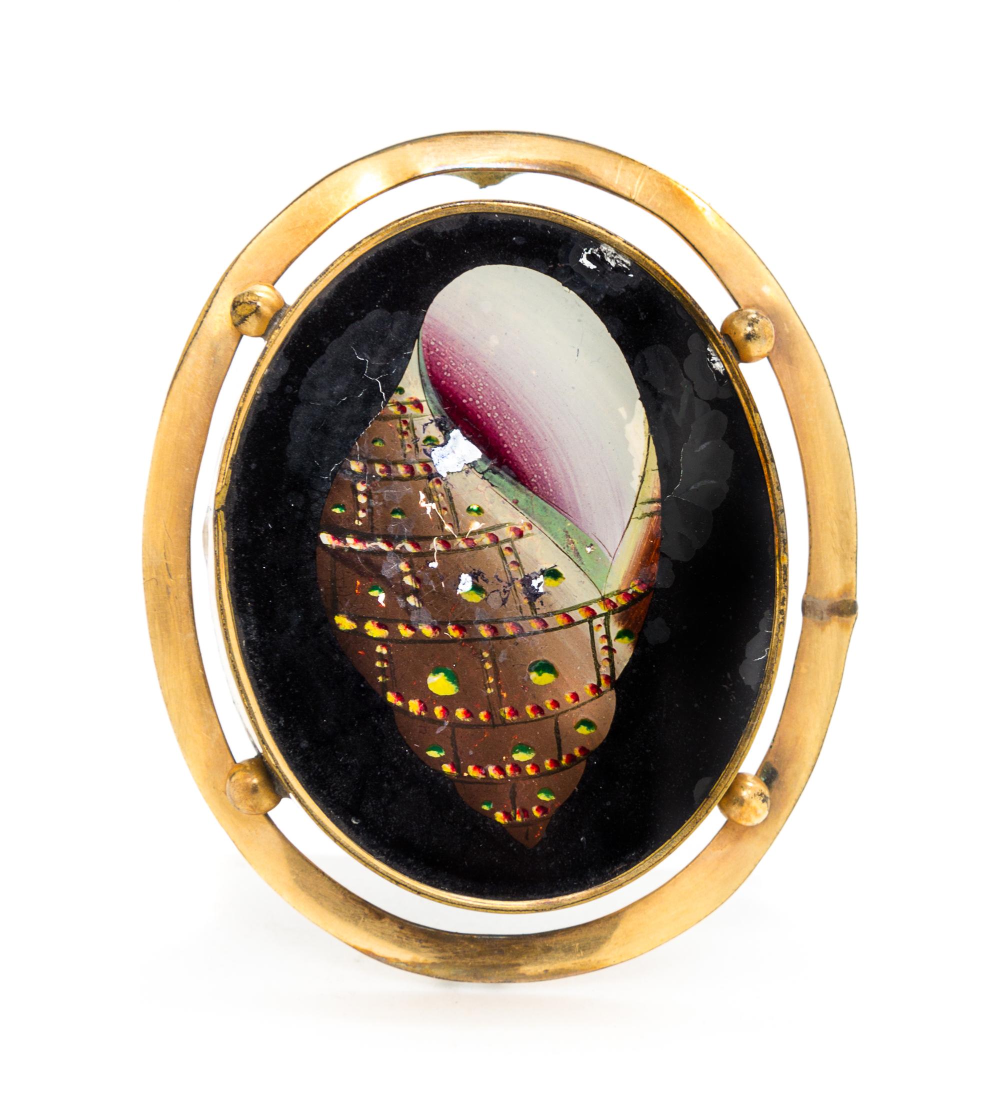 A Reverse Painted Brooch Height 2 inches.