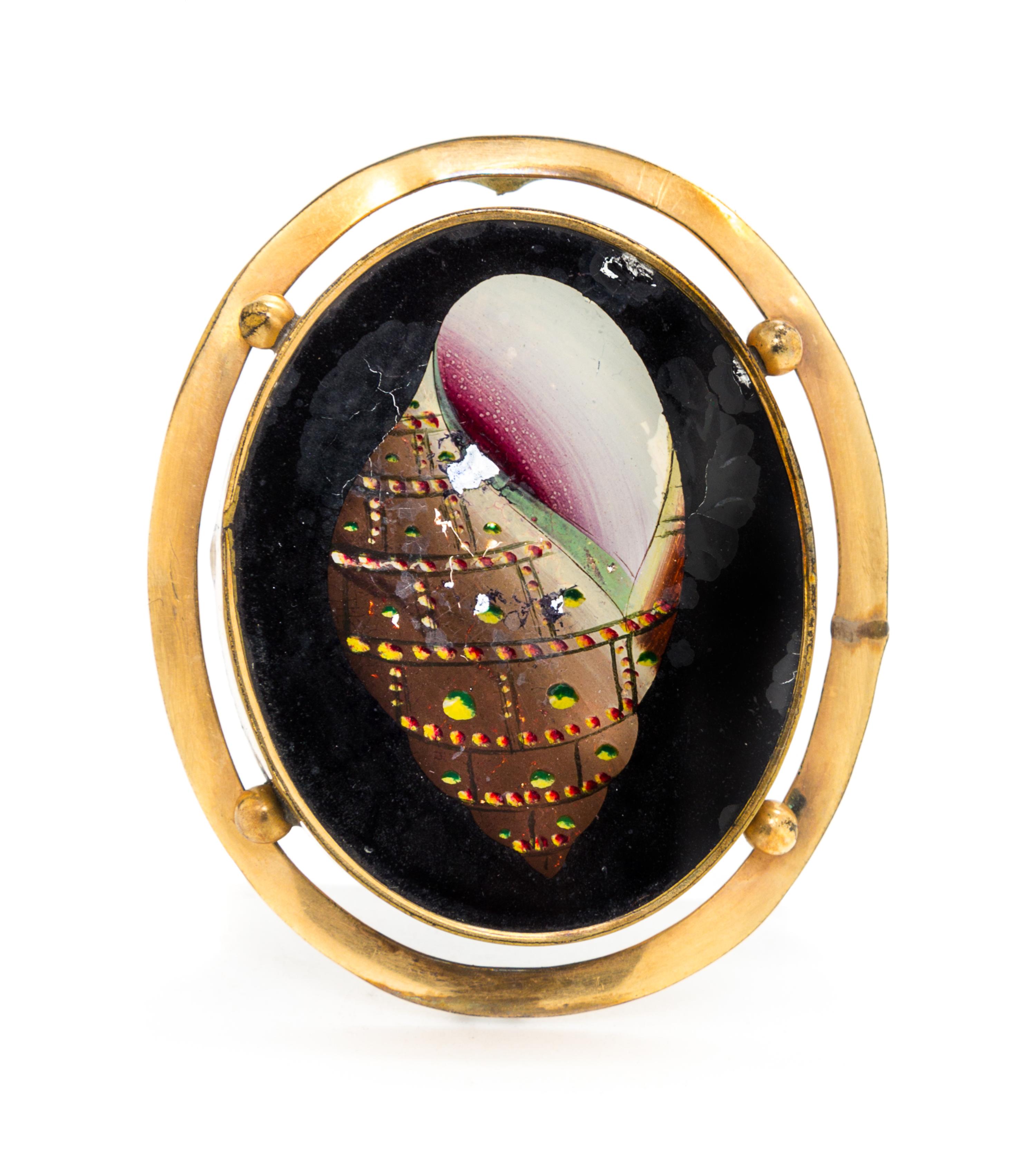 A Reverse Painted Brooch Height 2 inches.