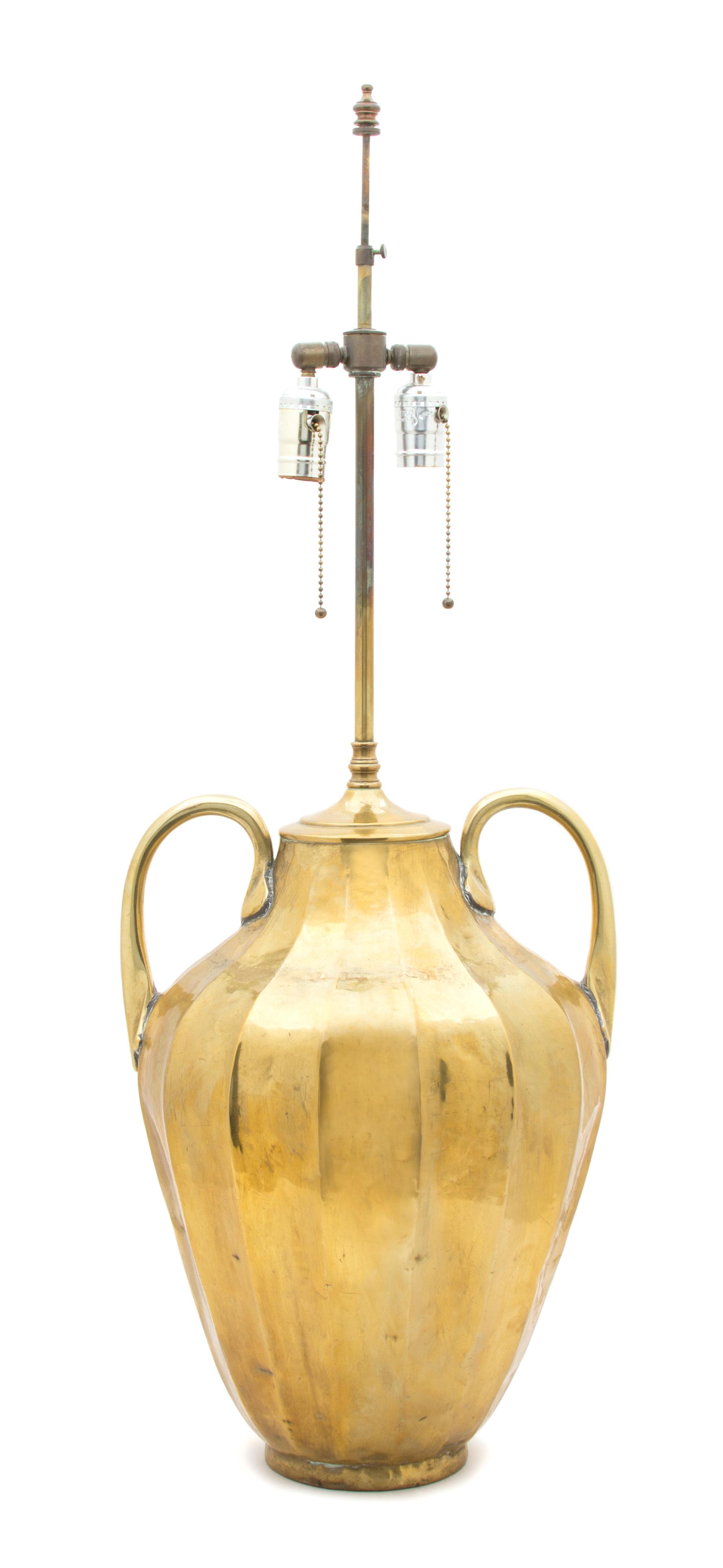 A Hand Hammered Brass Table Lamp Overall height 35 inches. — 20TH CENTURY