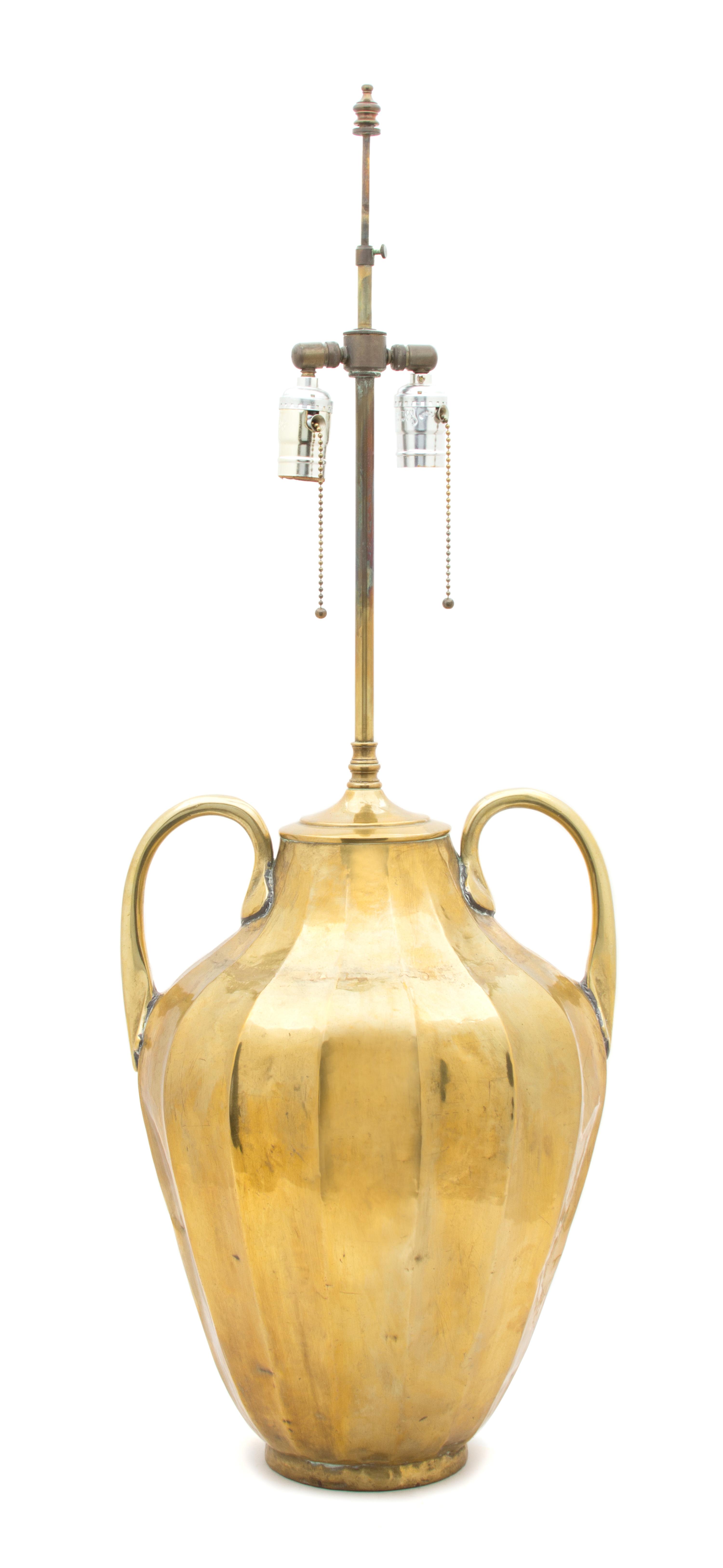 A Hand Hammered Brass Table Lamp Overall height 35 inches. — 20TH CENTURY