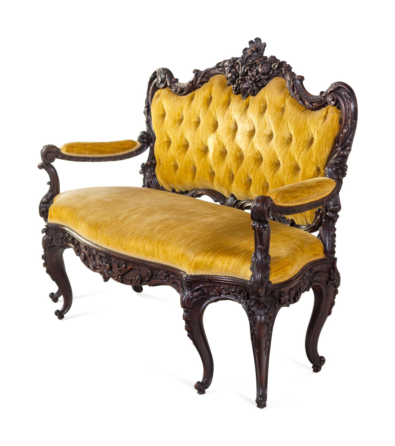 A Rococo Revival Carved Walnut Settee