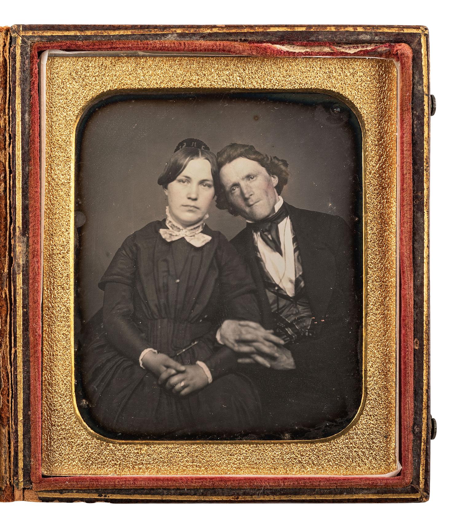 [EARLY PHOTOGRAPHY]. Sixth plate daguerreotype of an affectionately posed couple.