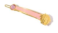 A Gianni Versace Pink Enamel and Medusa Hair Clip, 3.25" x .75".