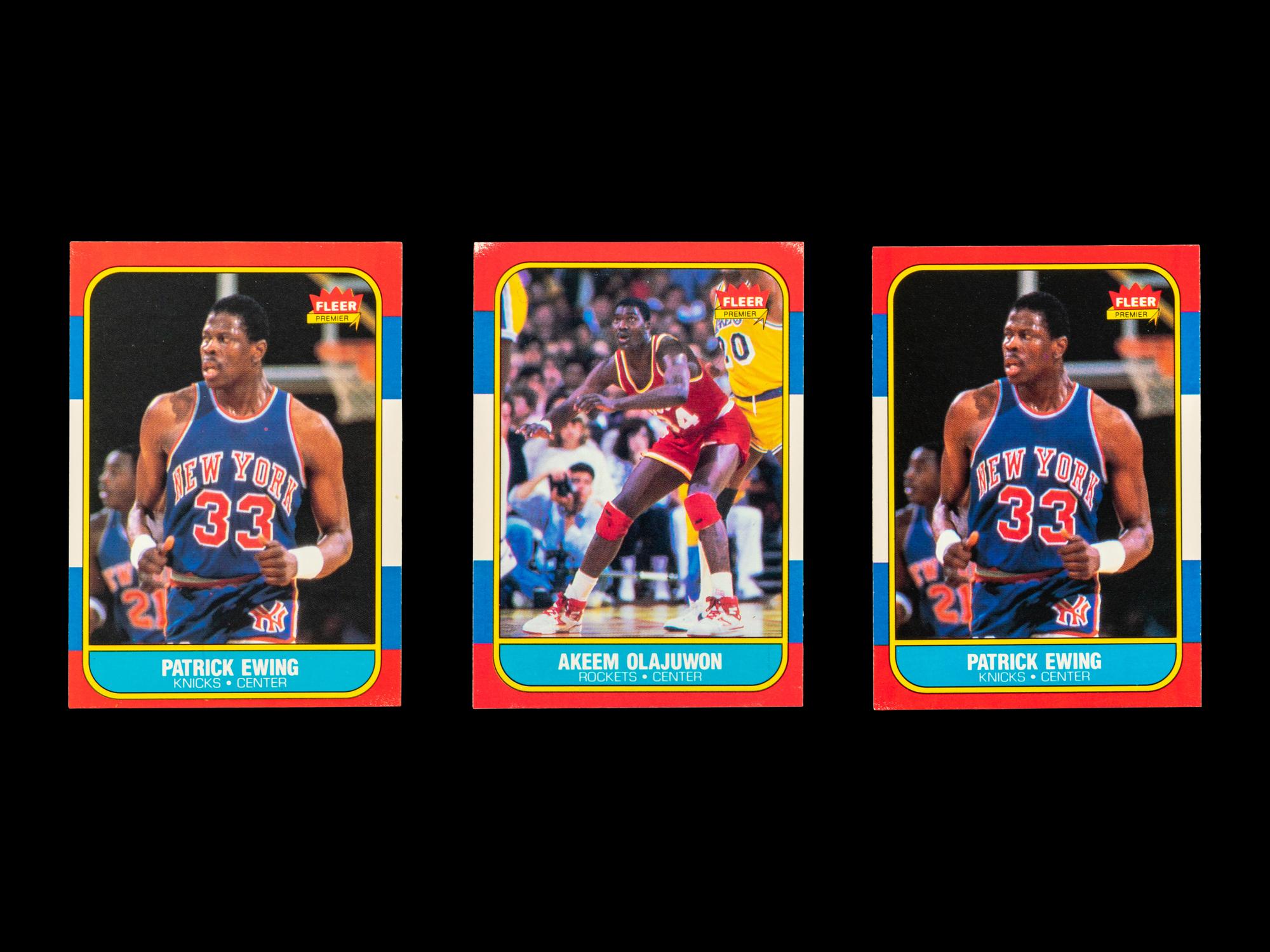 A Group of Three 1986 Fleer Patrick Ewing and Hakeem Olajuwon Rookie Basketball Cards,