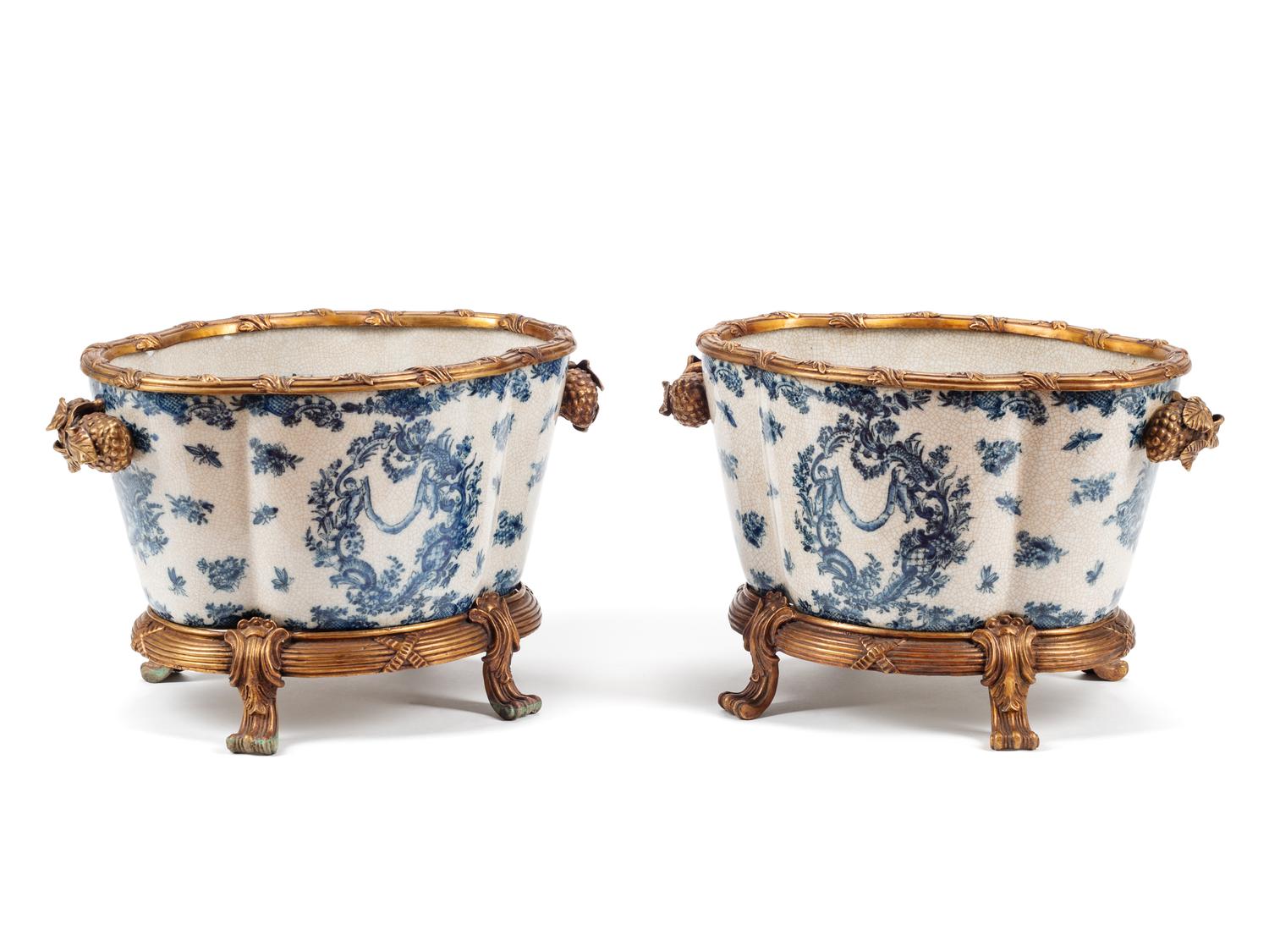 A Pair of Continental Gilt Bronze Mounted Blue and White Porcelain Jardinières