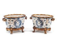 A Pair of Continental Gilt Bronze Mounted Blue and White Porcelain Jardinières