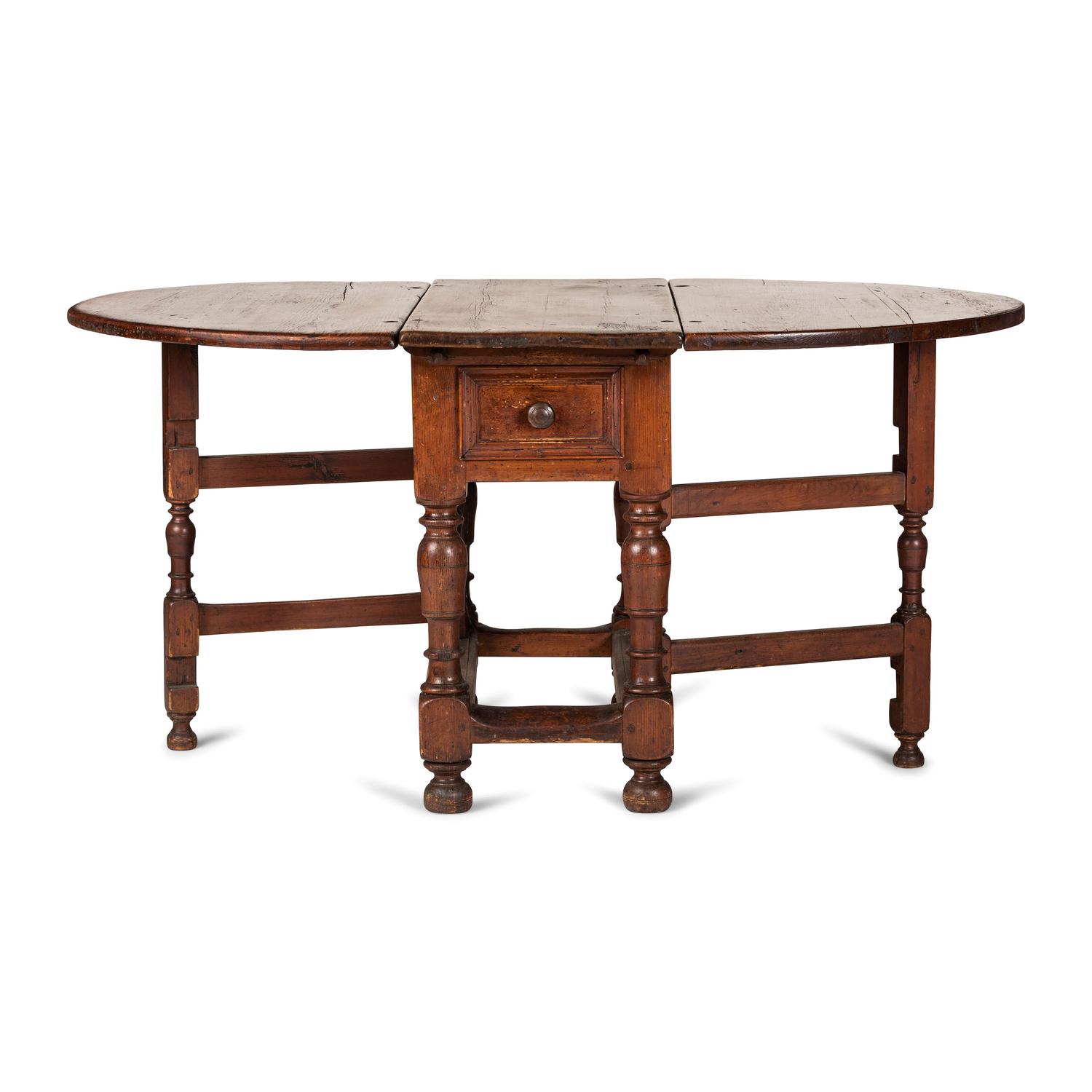 A Swedish Turned and Block Carved Pine Drop-Leaf Gate-Leg Dining Table