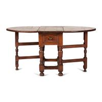 A Swedish Turned and Block Carved Pine Drop-Leaf Gate-Leg Dining Table