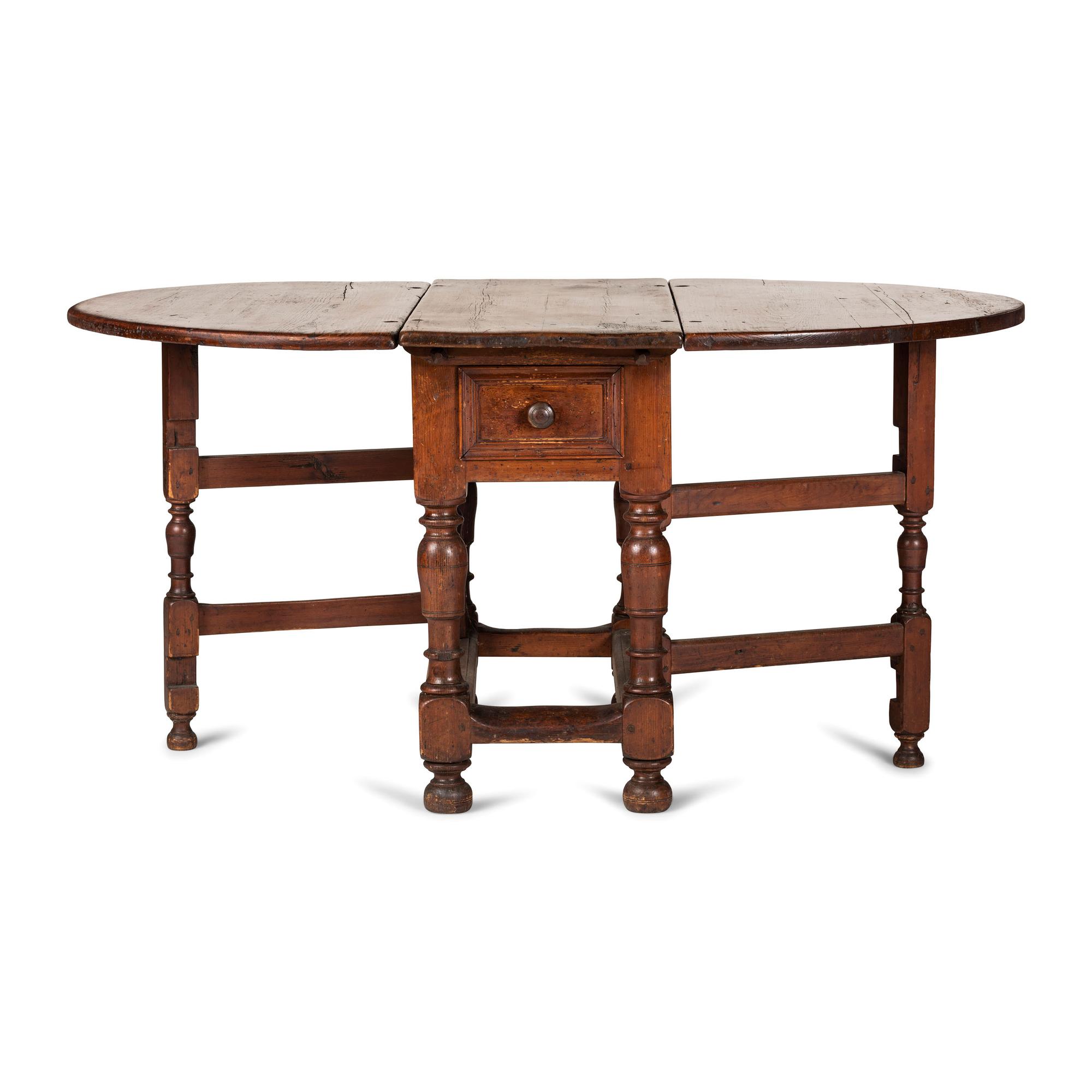 A Swedish Turned and Block Carved Pine Drop-Leaf Gate-Leg Dining Table