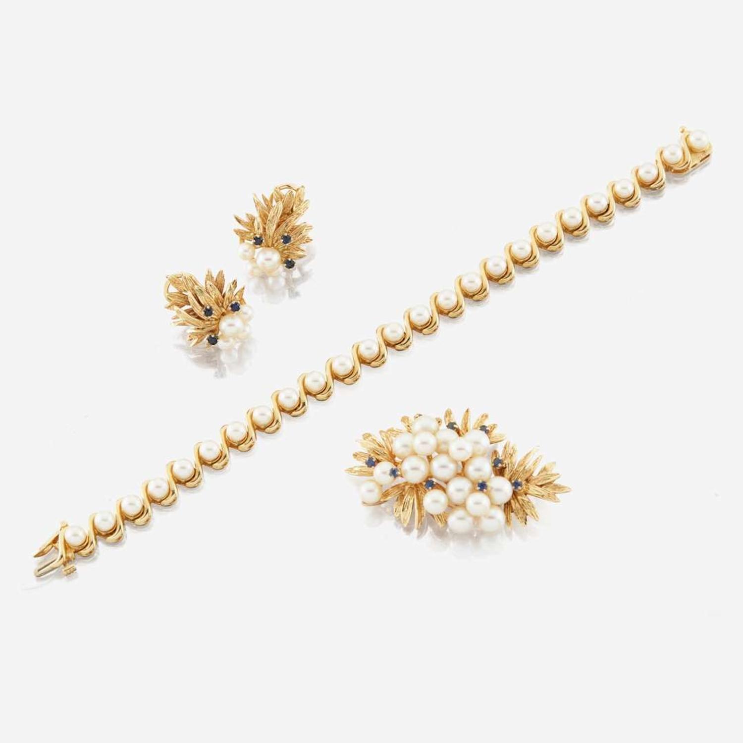 A collection of gold, cultured pearl, and sapphire jewelry
