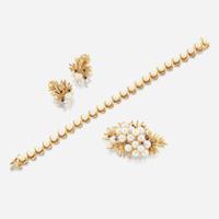 A collection of gold, cultured pearl, and sapphire jewelry