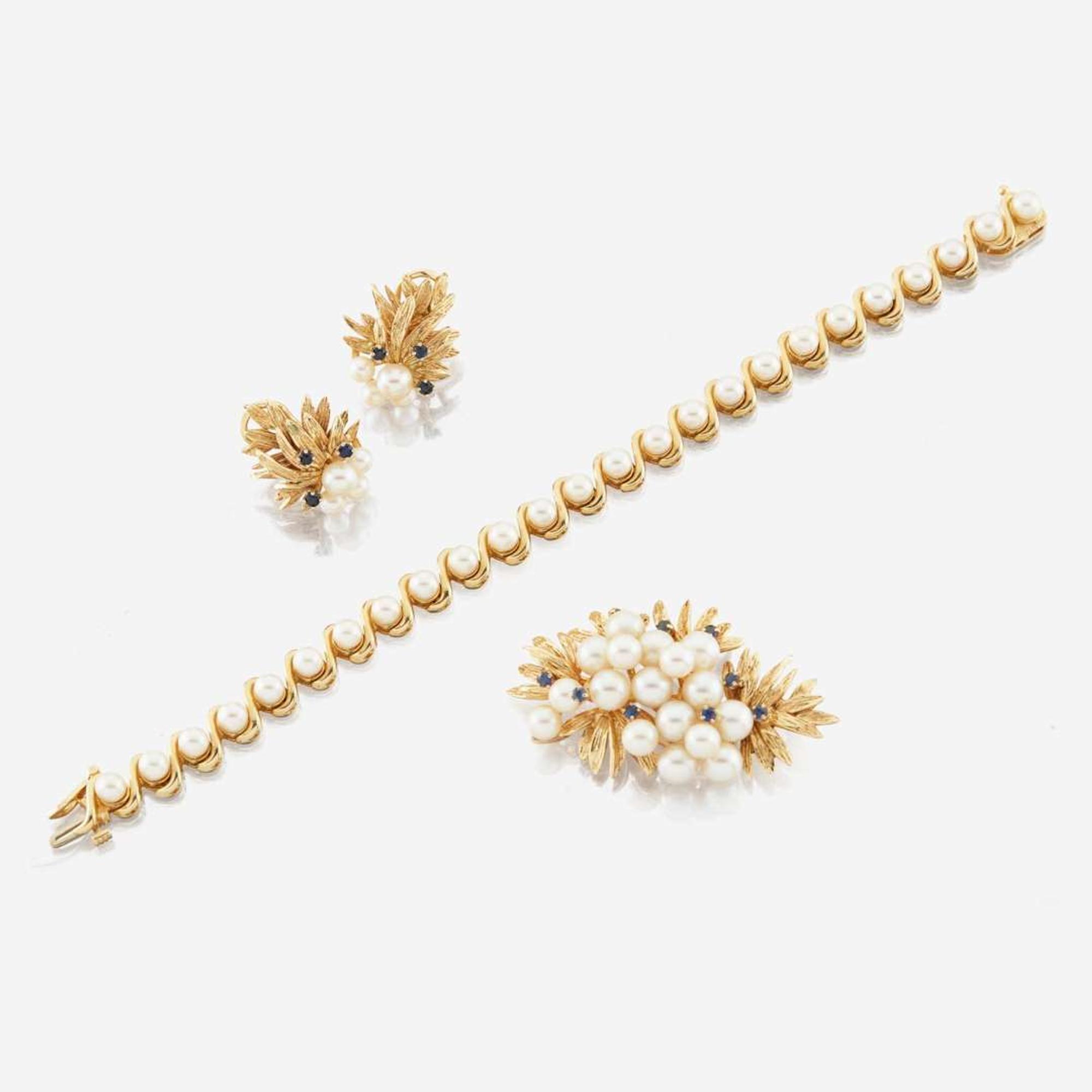 A collection of gold, cultured pearl, and sapphire jewelry