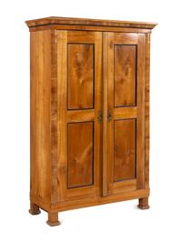 A Biedermeier Parcel Ebonized Birch Armoire