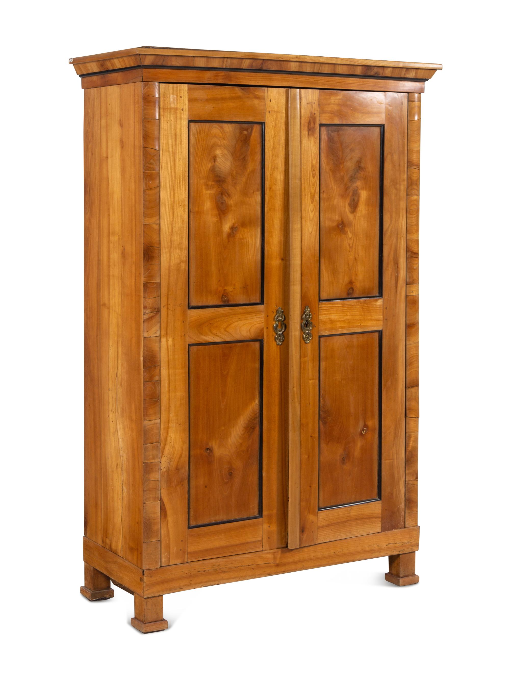 A Biedermeier Parcel Ebonized Birch Armoire