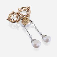 A natural pearl, diamond, eighteen karat gold, and platinum brooch