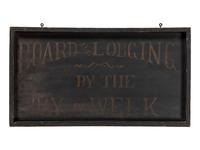 A Painted Wood Board and Lodging Sign