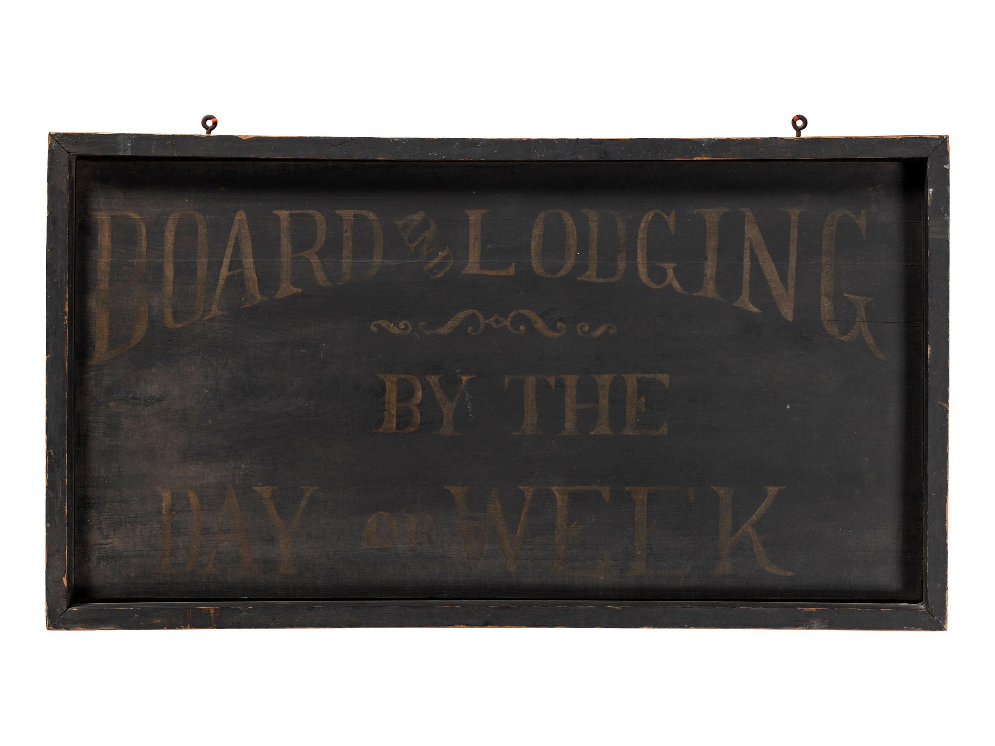 A Painted Wood Board and Lodging Sign