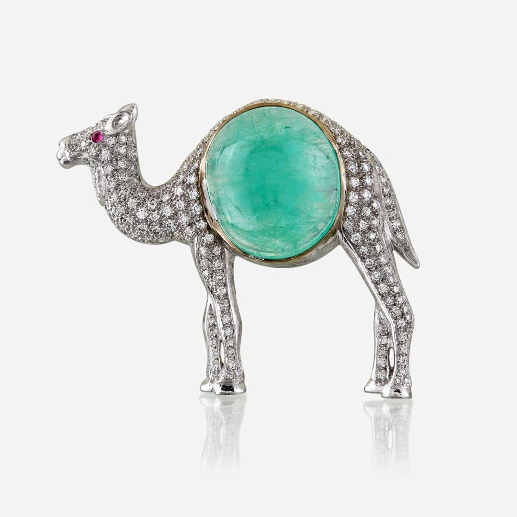 An emerald, diamond, and eighteen karat white gold brooch