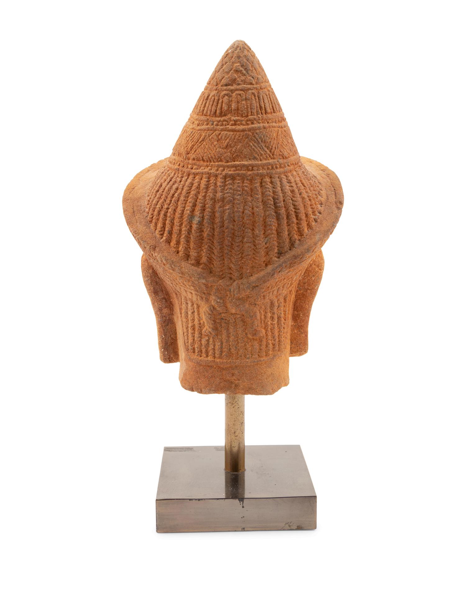 A Cambodian Sandstone Head of a Deity